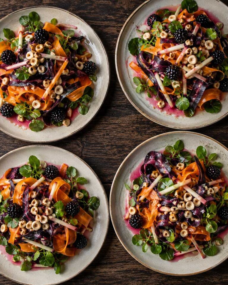 Carrot and cobnut salad with apple matchsticks, watercress and whole blackberries in a pink blackberry dressing
